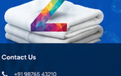 Folded white towels with ZEST brand accent
