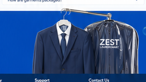 Dry cleaned suit in protective packaging